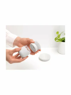 Saippuaa annosteleva tiskiharja